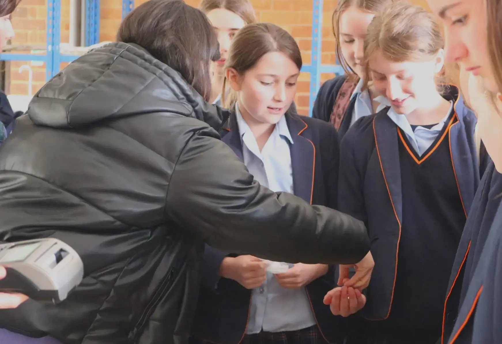 Students exchanging something on the playground