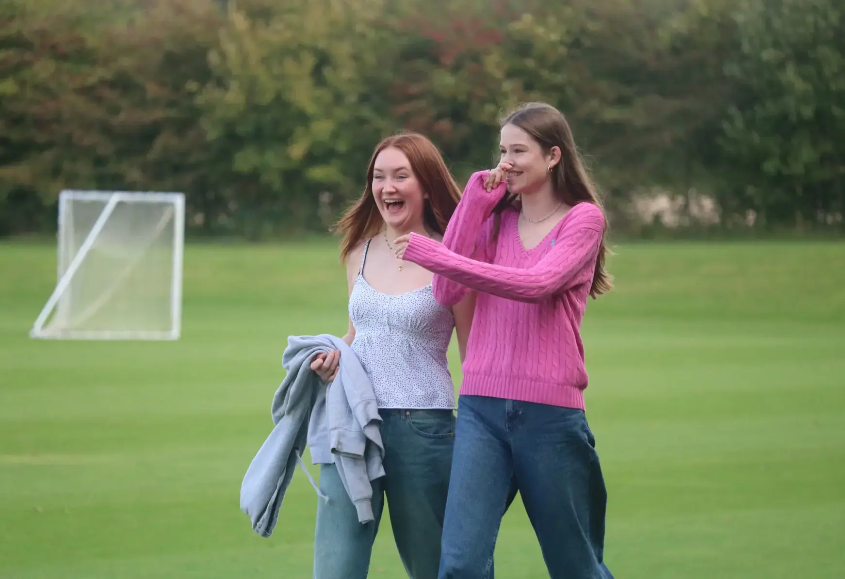 Students laughing on a field