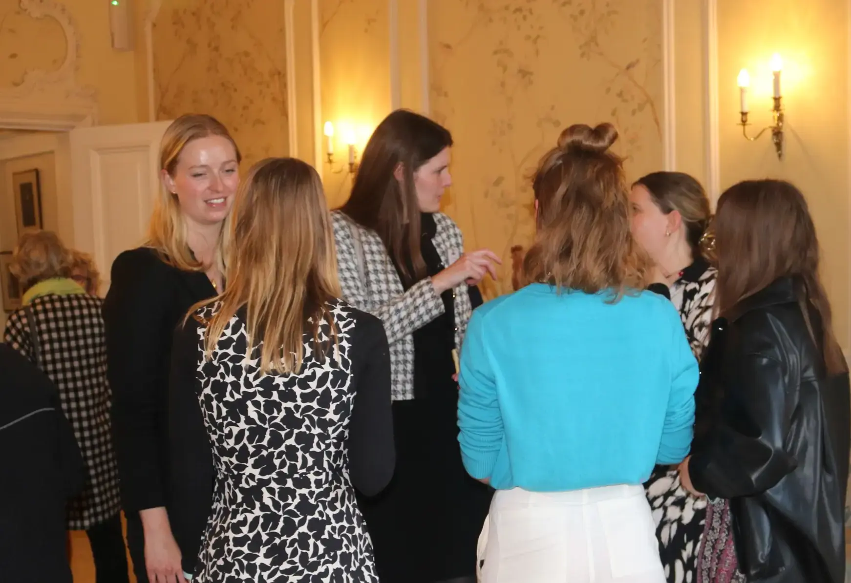 St Swithun's alumnae chatting in a circle