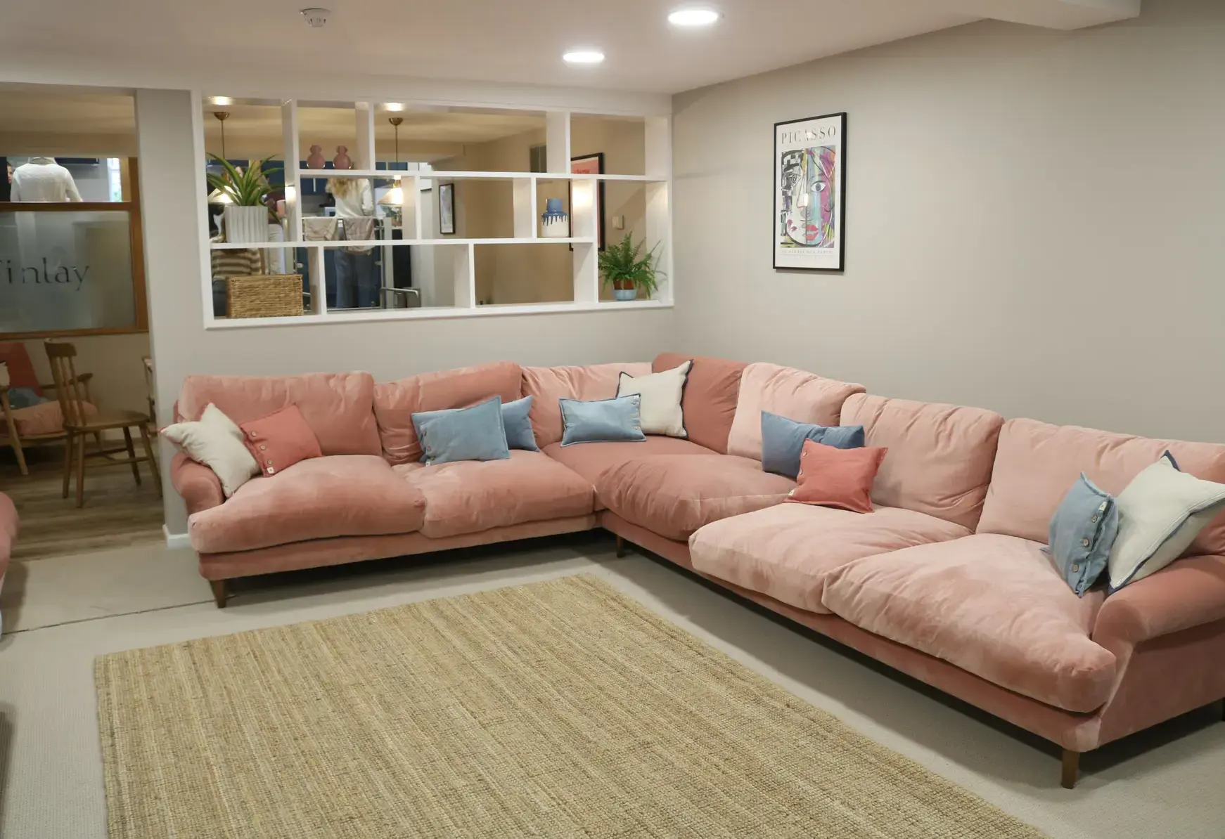 Student common room with large pink sofa