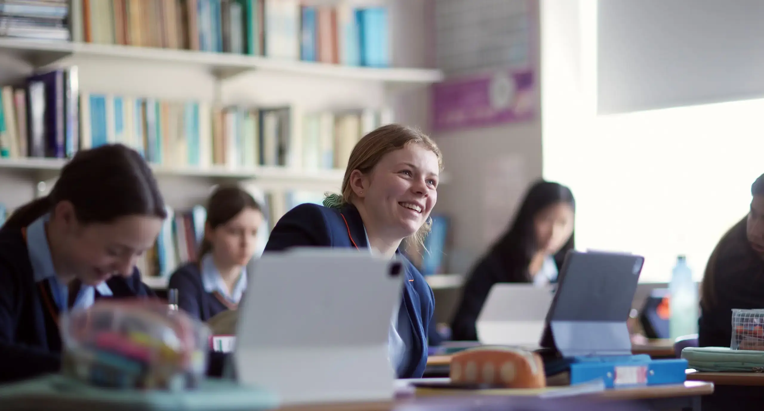 St Swithun's students laughing in classroom