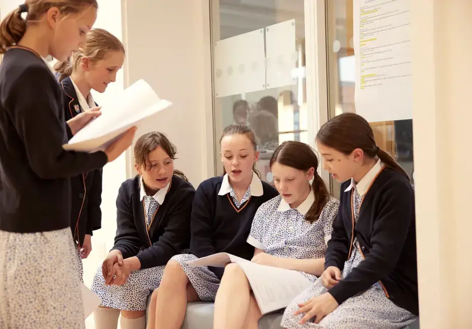 Kids helping each other with school work