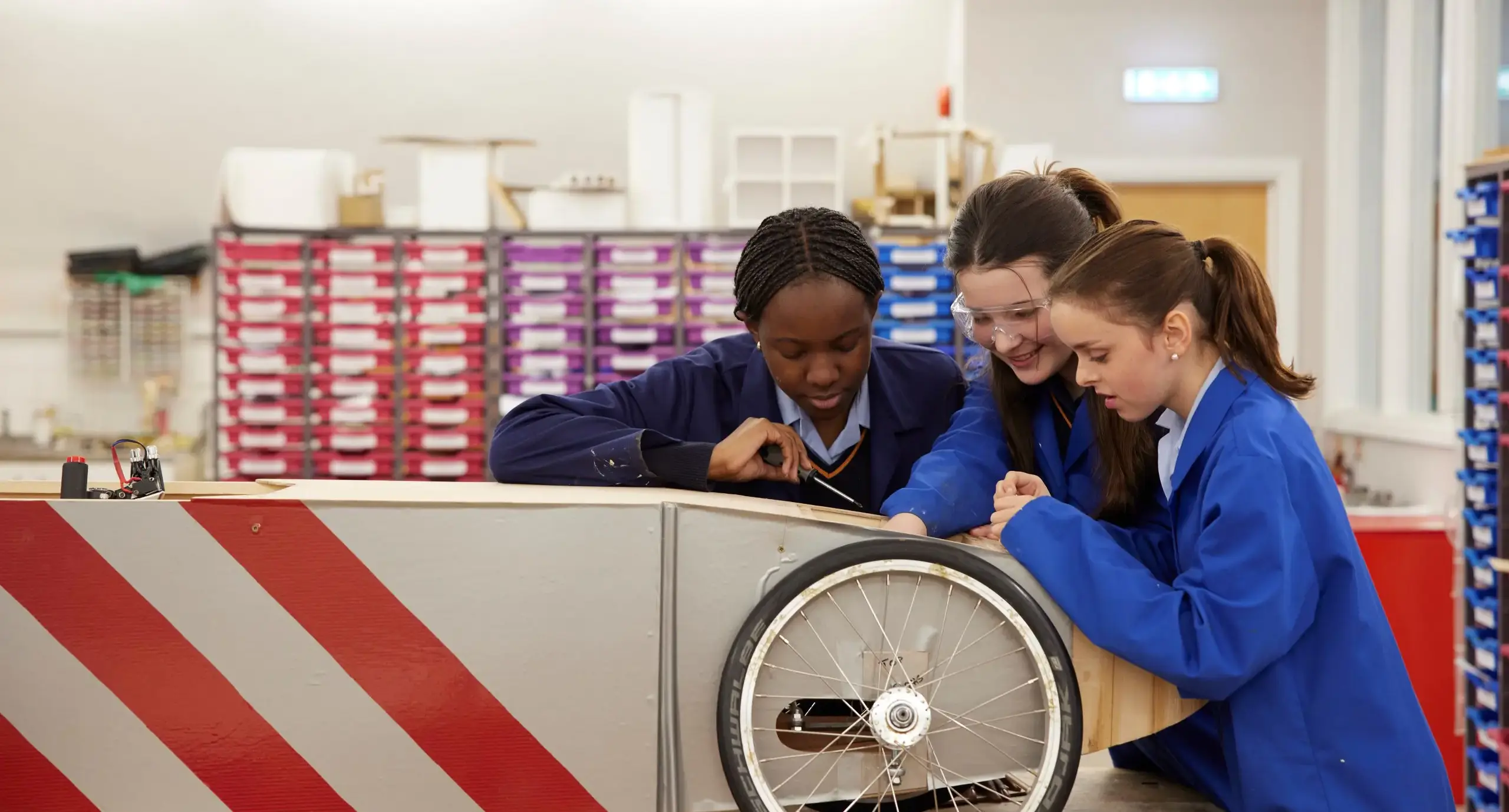 St Swithuns students enjoy a design technology lesson, working on their greenpower car