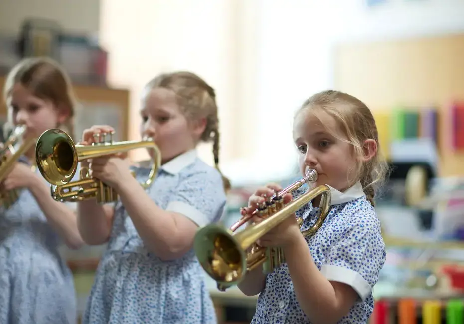 Students playing brass instruments