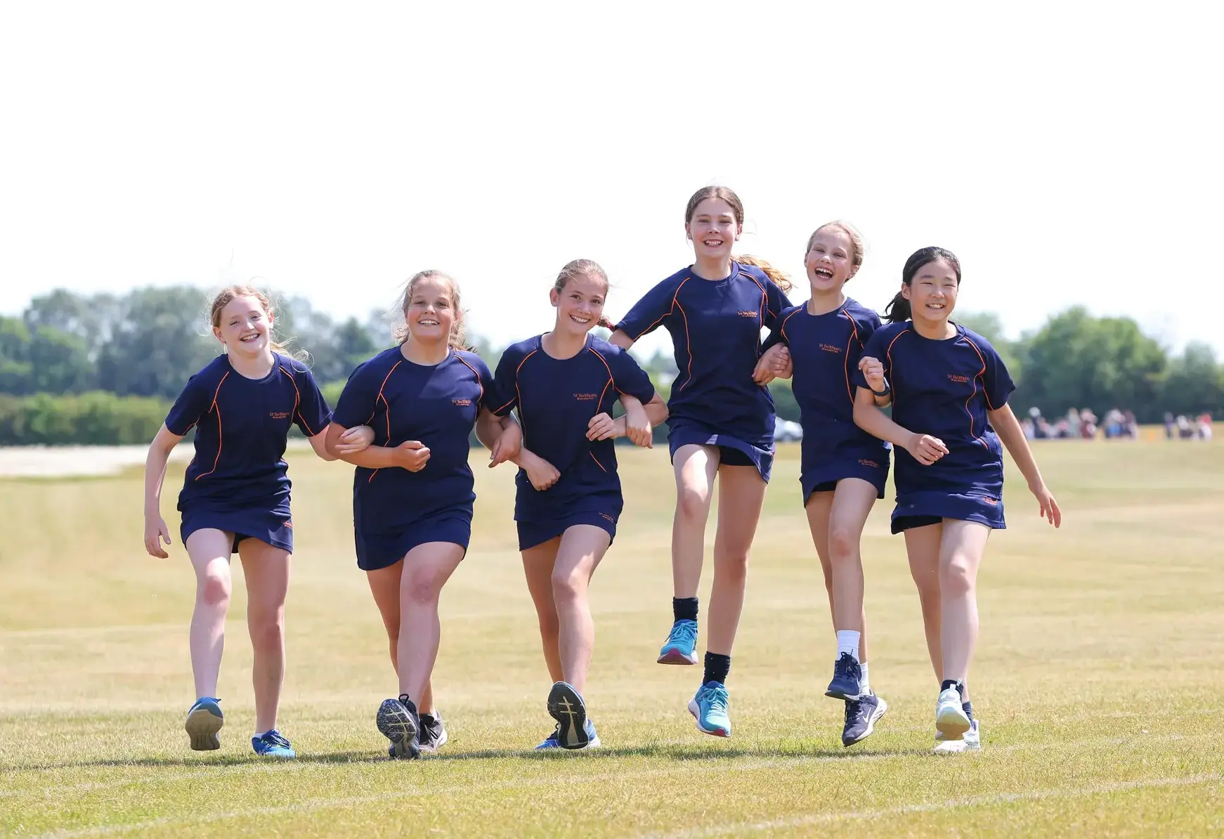 Student athletes posing on a field