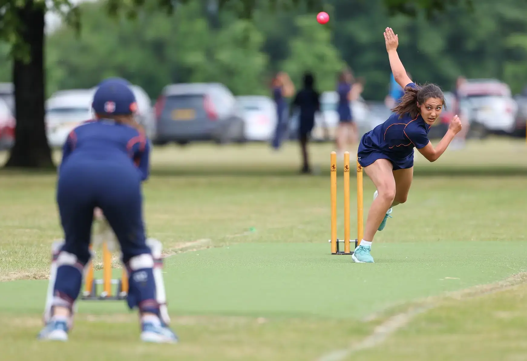 Student cricketer throwing a ball