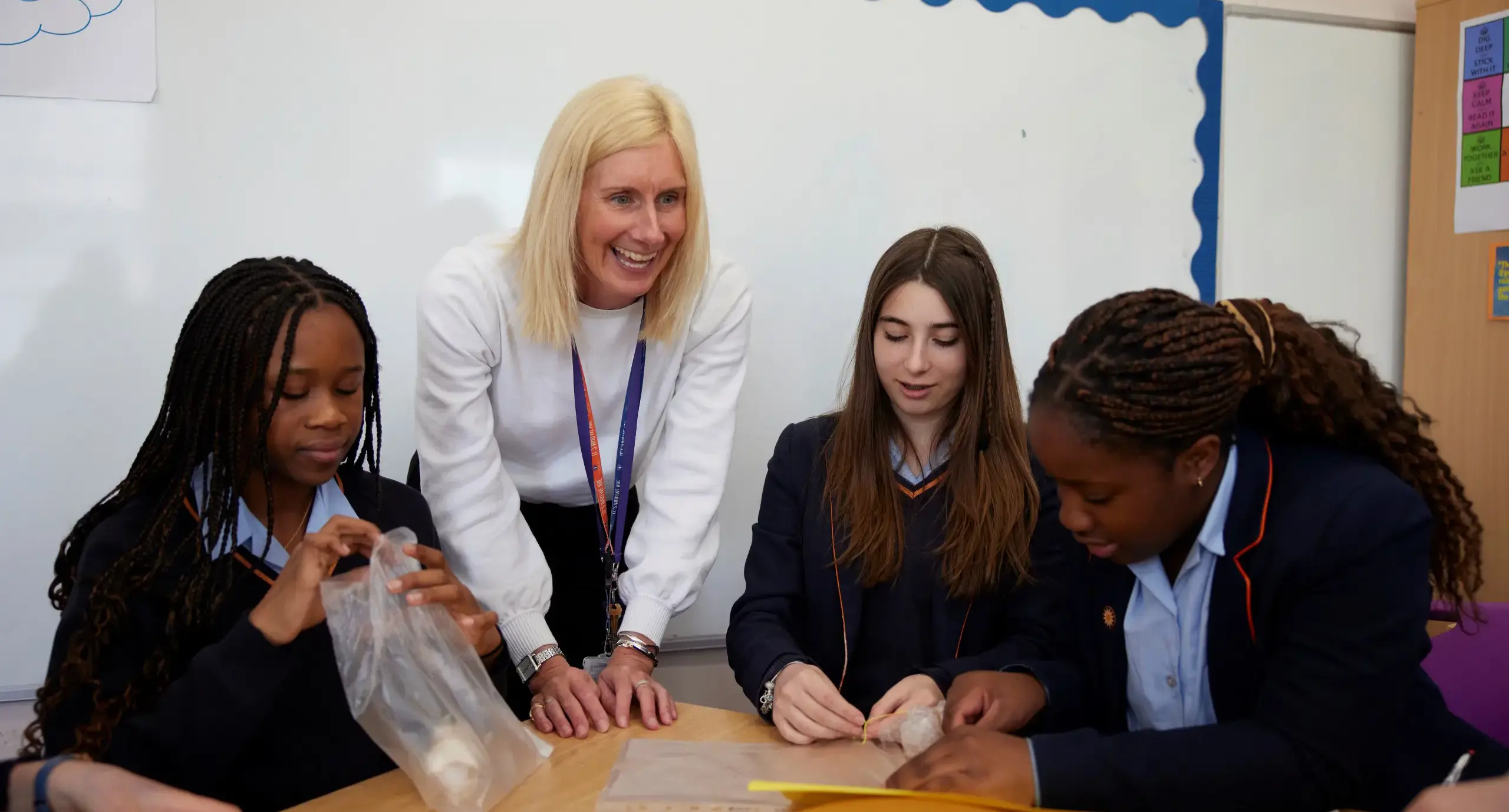 Teacher supporting students during lesson